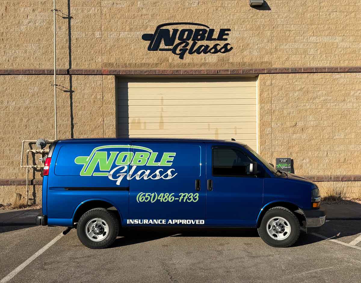 noble glass van outside building
